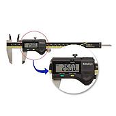 What is the SPC port on an electronic depth gauge used for?