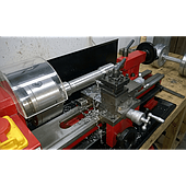 How does machining dumbbells using a lathe differ from the casting method?